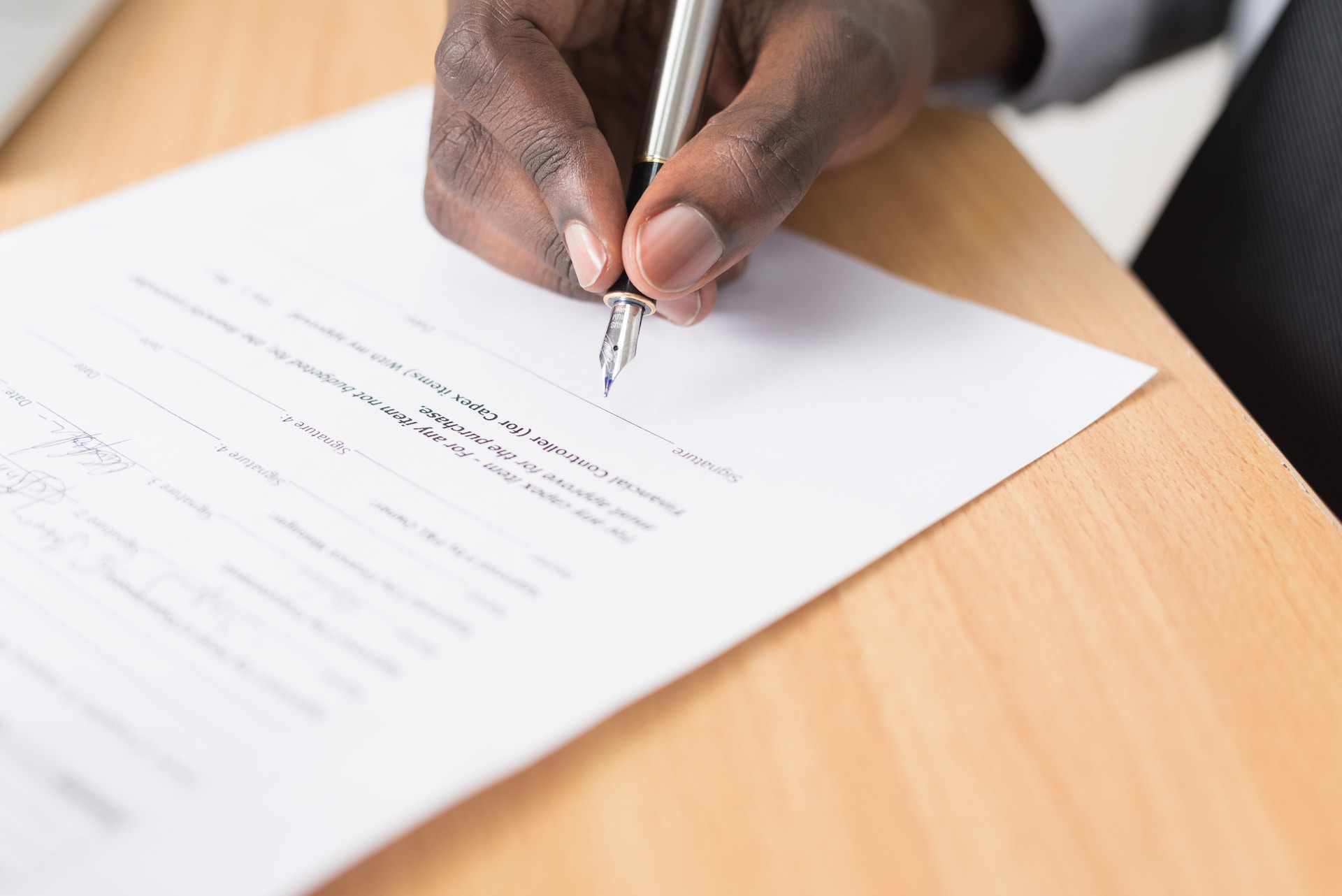a guy writing in pen on a paper reasons why your case will be dismissed a guy writing in pen on a paper reasons why your case will be dismissed
